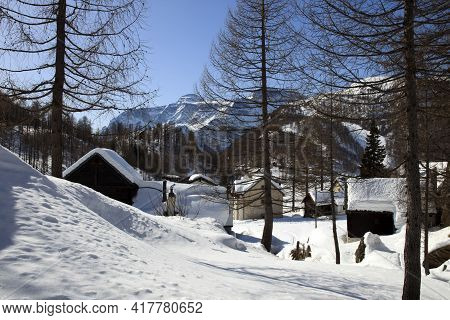 Devero Park ( Verbano-cusio-ossola ), Italy - January 15, 2017: Typical Houses In The Forest At Alpe