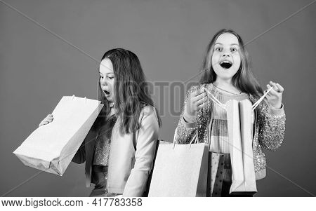 Sales And Discounts. Small Girls With Shopping Bags. Sisterhood And Family. Savings On Purchases. Ha