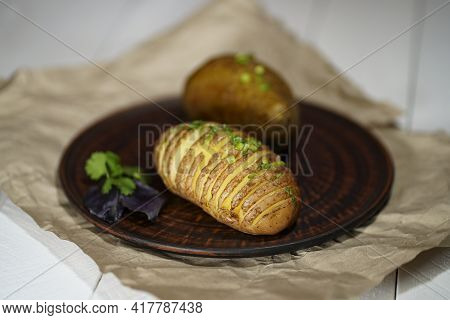 Baked Potatoes In The Skin On A Plate