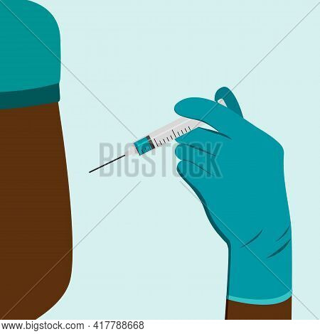 The Black Doctor Gives An Injection In The Shoulder, Arm Muscle. Coronavirus Vaccination, Doctor Inj