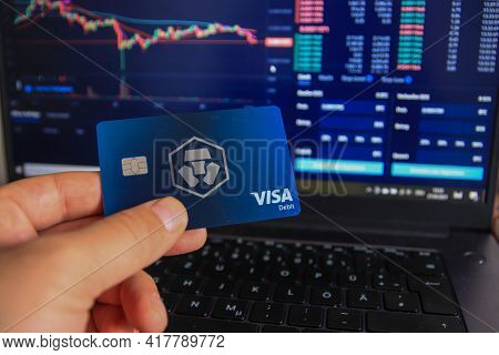 Berlin, Germany - April 21, 2021: Man Holding Crypto.com Debit Card In Hand. Crypto.com Is A Beginne