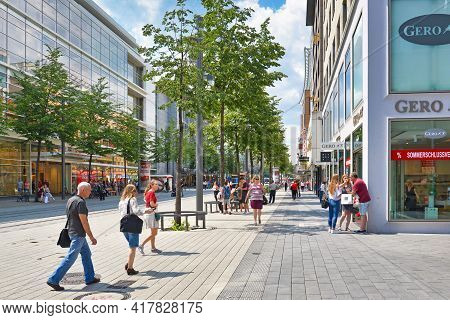 Mannheim, Germany - July 2019: People Walking Through City Center Of Mannheim With People And Variou