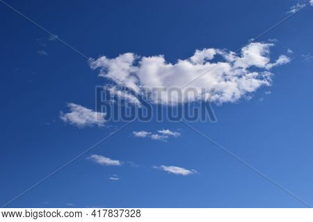 White Cloud In The Blue Sky. Blue Sky With Small White Clouds. Natural Background