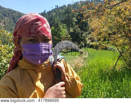 Close-up Of A Indian Young Woman Who Wearing Dhatu (himachal Fashion Accessory) And Face Mask, A Asi