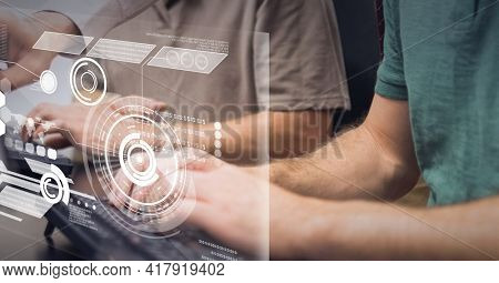 Composition of scope scanning and data processing on screen over men typing on computer keyboards. global technology and digital interface concept digitally generated image.