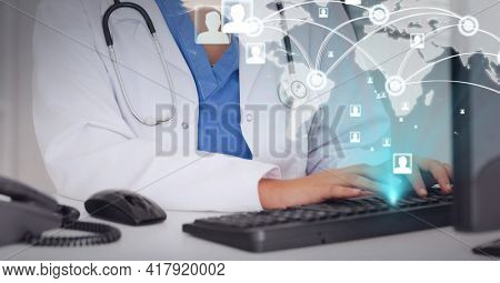 Composition of network of connections and world map over doctor typing on computer keyboard. global technology and digital interface concept digitally generated image.