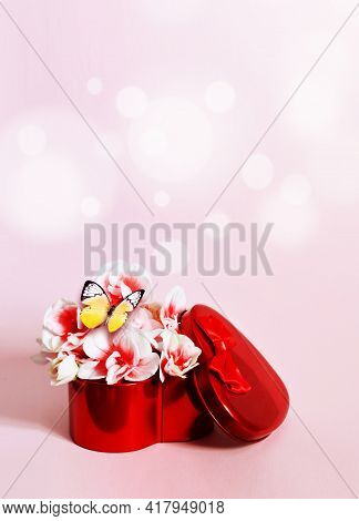 Heart Shape Gift Box And Bouquet With Butterfly On Pink Background.