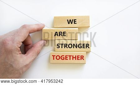 Stronger Together Symbol. Wooden Block With Words 'we Are Stronger Together'. Beautiful White Backgr