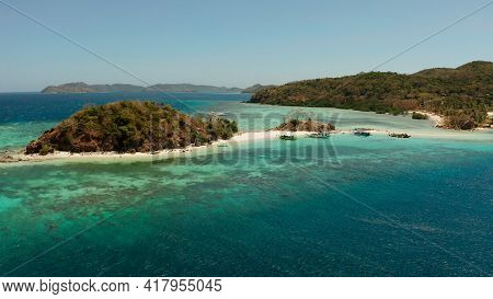 Aerial Seascape Tropical Beach With White Sand And Clear Blue Sea. Tropical Landscape With Islands A