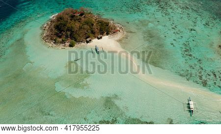 Aerial Drone Tourists Enjoy Tropical Beach. Tropical Island And Sand Beach, Turquoise Water And Cora