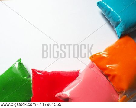 Colorful Kid's Plasticine On White Background, Colorful Dough Modeling Clay. Packing Of Colored Soft