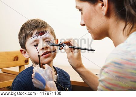 Little Cute Child Making Facepaint On Birthday Party, Zombie Apocalypse Facepainting, Halloween Prep