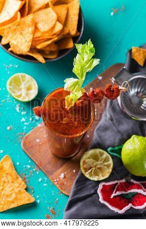 Mexican Alcohol Cocktail Clamato Beer With Shrimps And Celery Stick