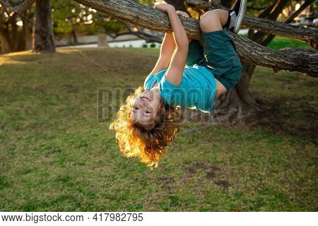 Child Climbing In Adventure Activity Park. Insurance Kids. Health Care Insurance Concept For Kids. M