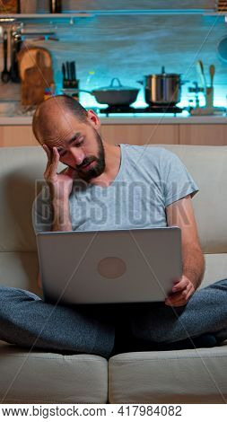 Tired Man In Pajams Browsing On Internet Lifestyle Information