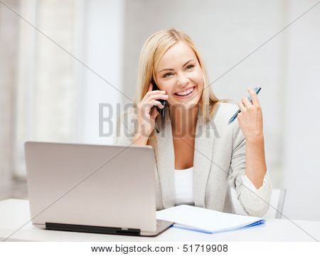 business and communication - smiling businesswoman with smartphone in office