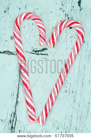 Candy Cane Heart On A Wooden Background