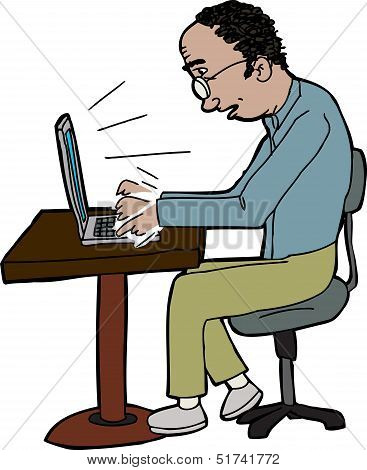 Man Typing On Laptop