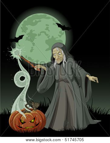 Halloween witch casts a spell over pumpkin