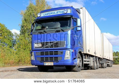 Blue Volvo Fh Truck With Full Trailer