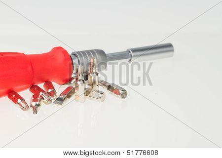 Screwdriver And Bits On Isolated White Background