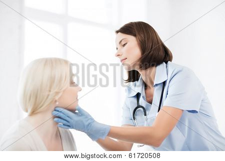 healthcare, medical and plastic surgery concept - plastic surgeon or doctor with patient