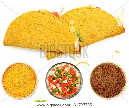 Two Tacos Stacked on White Background with cheese and lettuce. Bowl of cheese, trinity  and meat below.