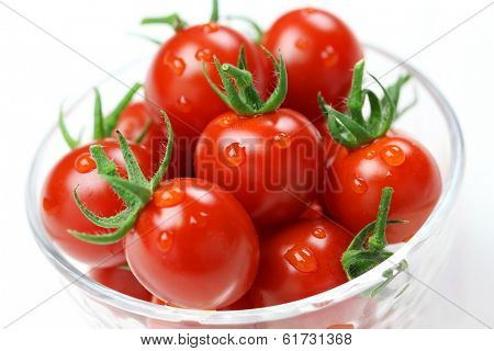 cherry tomatoes in glass bowl isolated on white background, lycopene image