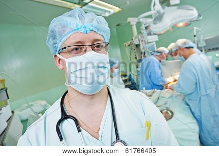 anaesthesiologist doctor in uniform preparing narcosis anaesthesia during heart transplantation operation at cardiac surgery clinic