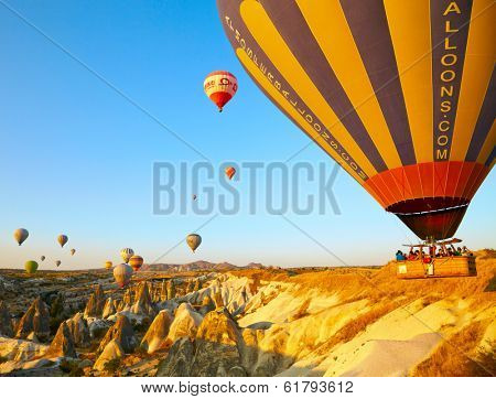 GOREME, TURKEY - AUGUST 25: Hot air balloon fly over Cappadocia on august 25, 2013 in Goreme, Cappadocia, Turkey.