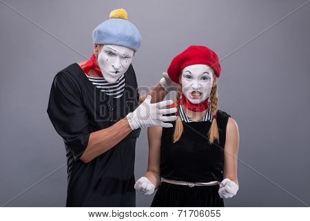 Couple of two funny mimes isolated on background