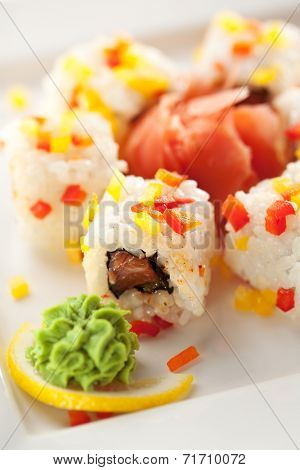 Fish Maki Sushi - Roll with Salmon and Lettuce inside. Sliced Paprika ouside