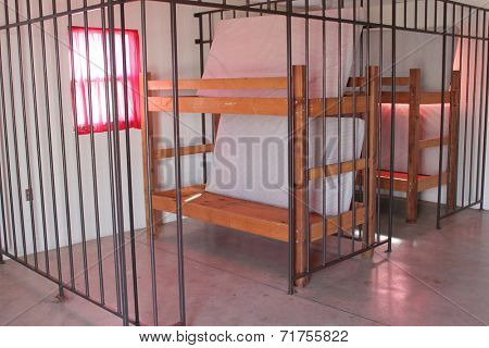 A double bunk in a pretend jail cell.