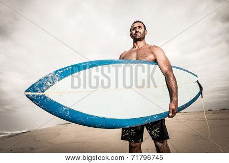 Surfer Wathing The Waves