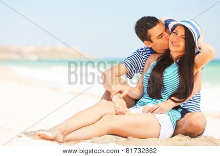 Beautiful Couple Kissing On The Beach.
