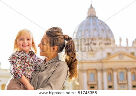 Portrait Of Happy Mother And Baby Girl In Front Of Basilica Di S
