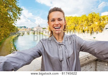 Smiling Young Woman Making Selfie On Bridge Ponte Umberto I With View On Basilica Di San Pietro