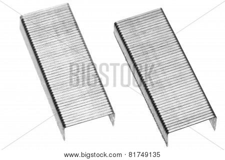 Stack Of Metal Staples. Isolated On A White.