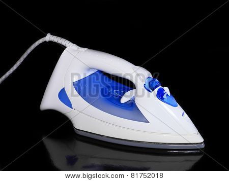 Electric Iron On Black Background.