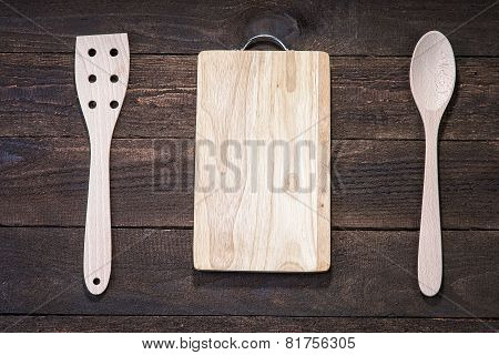 Wooden kitchenware and cutting board on the wood table