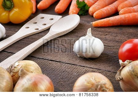 Healthy vegetables on a wooden background