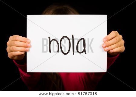 Child Holding Sign With Spanish Word Hola - Hello