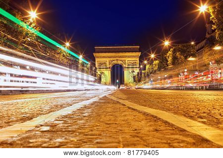 Evening On Champs-elysees In Front Of Arc De Triomphe.paris. France.