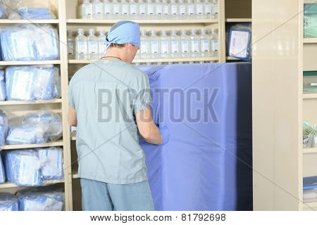 Medical staff sterilizing hands and arms before surgery