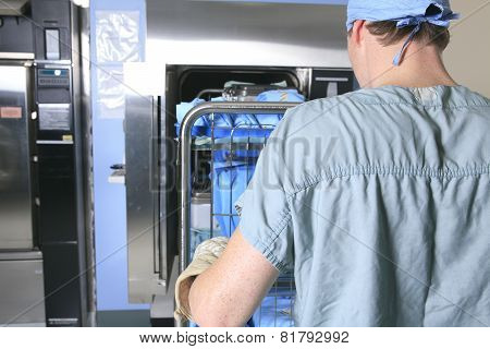 Medical staff sterilizing hands and arms before surgery