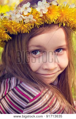 Girl with chaplet on head in the garden