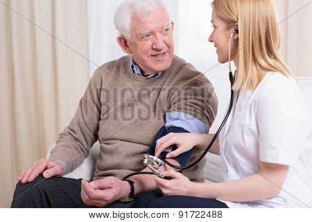 Caregiver Checking The Hypertension