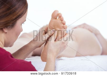 Physiotherapist doing reflexology