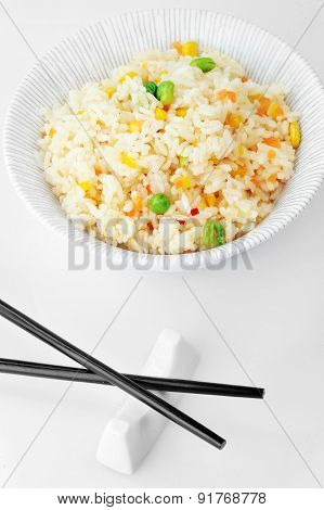 Bowl With Rice And Chopsticks Close Up