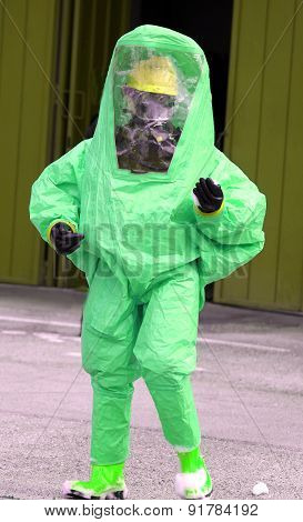 Man With Green Protective Suit Against Biological Risk